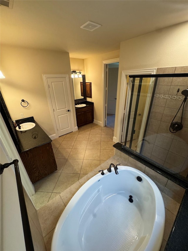 2823 Millington Dr, Highland Village, TX 75077 - bathroom featuring vanity, a bath, tile patterned flooring, baseboards, and a tile shower