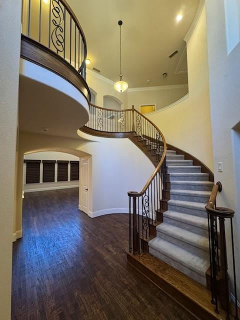 2823 Millington Dr, Highland Village, TX 75077 - stairway featuring wood finished floors, ornamental molding, baseboards, and arched walkways