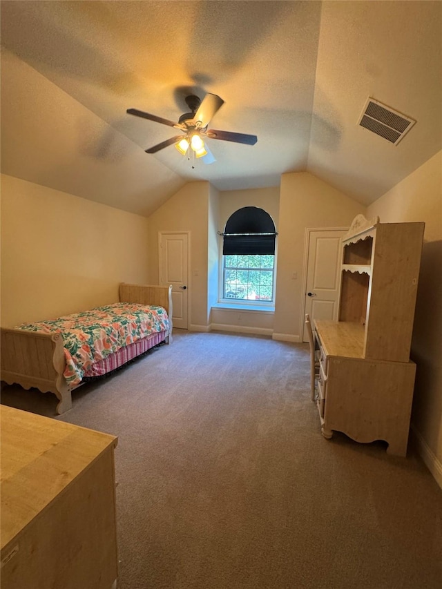 2823 Millington Dr, Highland Village, TX 75077 - bedroom with lofted ceiling, carpet floors, baseboards, a textured ceiling, and ceiling fan