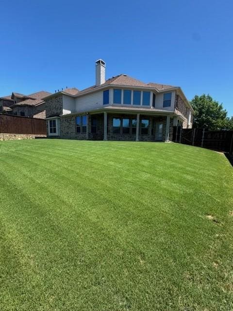 2823 Millington Dr, Highland Village, TX 75077 - back of property featuring a chimney