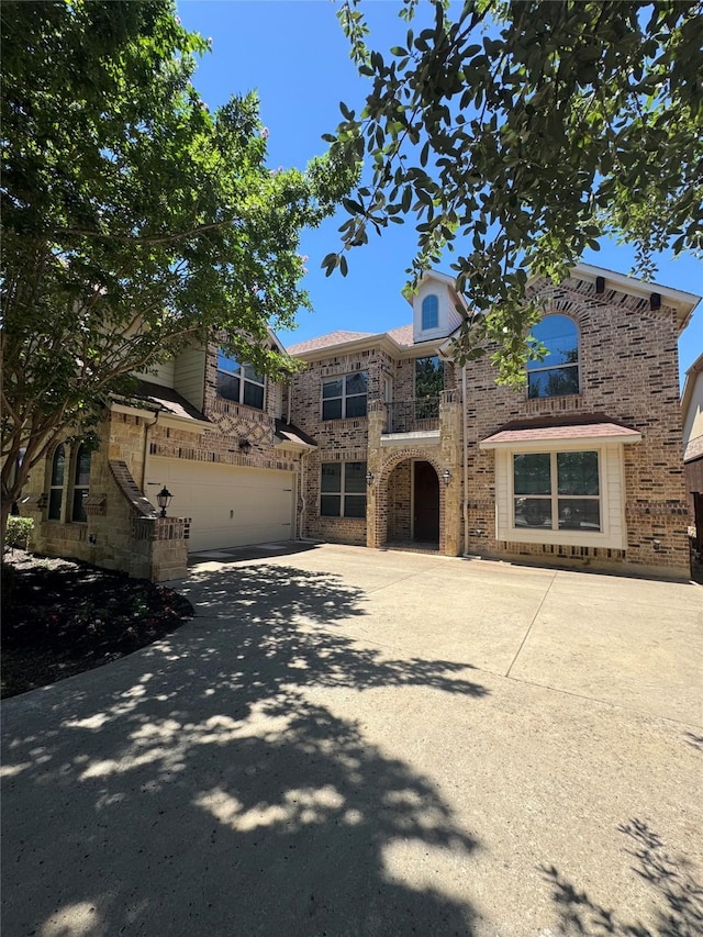 2823 Millington Dr, Highland Village, TX 75077 - view of front of property featuring a garage, concrete driveway, and stone siding