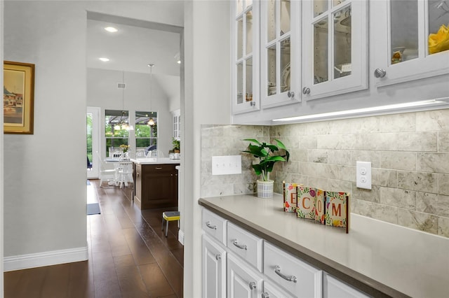 602 Limmerhill Dr, Rockwall, TX 75087 - bar with recessed lighting, baseboards, backsplash, and dark wood finished floors