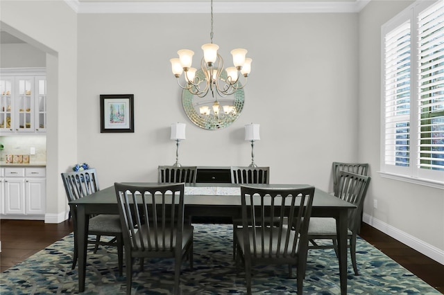 602 Limmerhill Dr, Rockwall, TX 75087 - dining space featuring dark wood-type flooring, a wealth of natural light, and an inviting chandelier