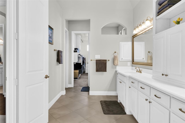 602 Limmerhill Dr, Rockwall, TX 75087 - bathroom with baseboards, vanity, and tile patterned floors