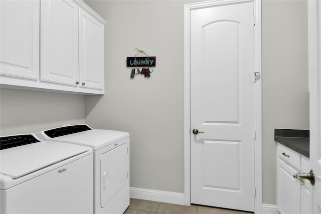 602 Limmerhill Dr, Rockwall, TX 75087 - clothes washing area with baseboards, cabinet space, light tile patterned floors, and washer and dryer