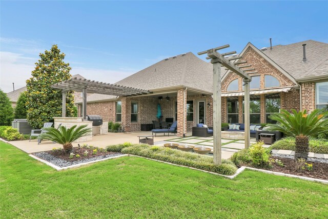 602 Limmerhill Dr, Rockwall, TX 75087 - rear view of house with brick siding, a yard, and a pergola