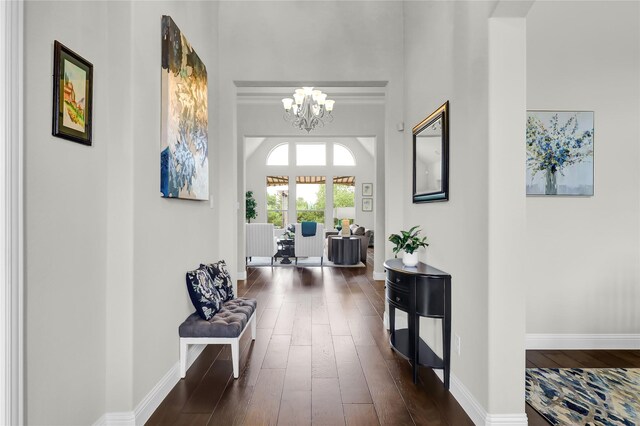 602 Limmerhill Dr, Rockwall, TX 75087 - hallway featuring an inviting chandelier, baseboards, and dark wood-style flooring