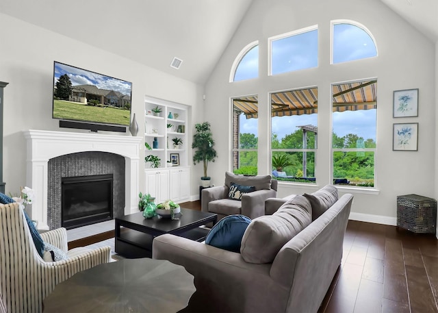 602 Limmerhill Dr, Rockwall, TX 75087 - living area with high vaulted ceiling, visible vents, plenty of natural light, and dark wood-type flooring