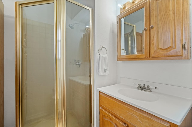 full bathroom featuring a shower stall and vanity