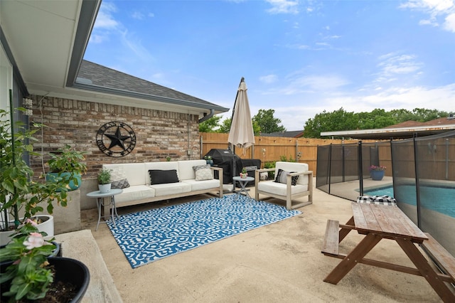 view of patio / terrace with grilling area, a fenced in pool, an outdoor hangout area, and a fenced backyard