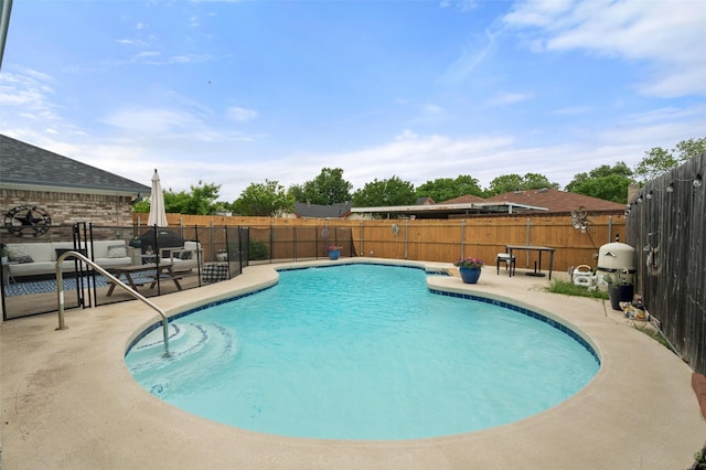 view of pool featuring a fenced in pool, a fenced backyard, and a patio area