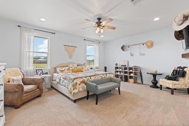 carpeted bedroom featuring visible vents, recessed lighting, and a ceiling fan