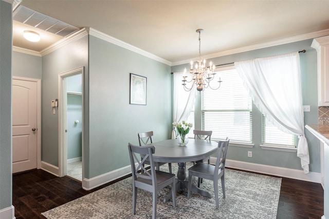 dining space featuring crown molding, dark wood finished floors, baseboards, and a chandelier