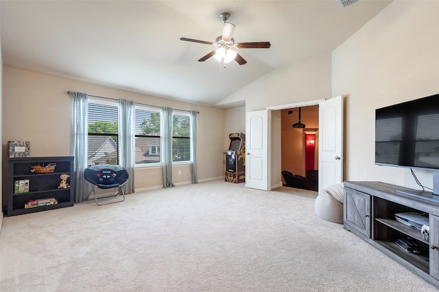 interior space with carpet floors, ceiling fan, baseboards, and lofted ceiling