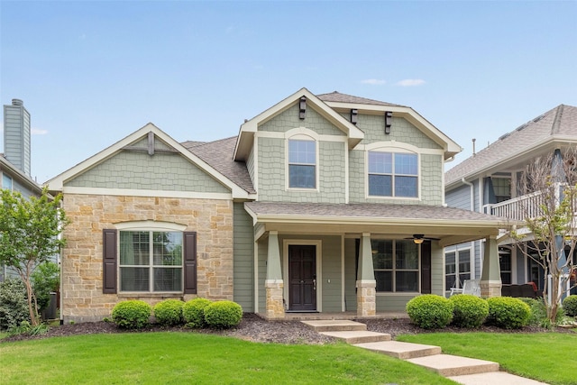 2606 Kennedy Dr, Melissa, TX 75454 - craftsman inspired home featuring stone siding, a front yard, covered porch, and a shingled roof