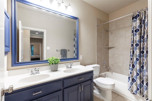 bathroom featuring double vanity, toilet, shower / bathtub combination with curtain, and a sink