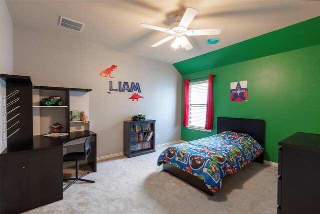 carpeted bedroom featuring a ceiling fan, baseboards, visible vents, and lofted ceiling