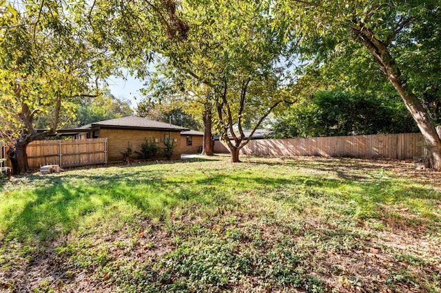 view of yard featuring a fenced backyard