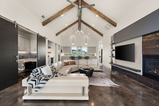 living area with baseboards, concrete flooring, high vaulted ceiling, and beam ceiling
