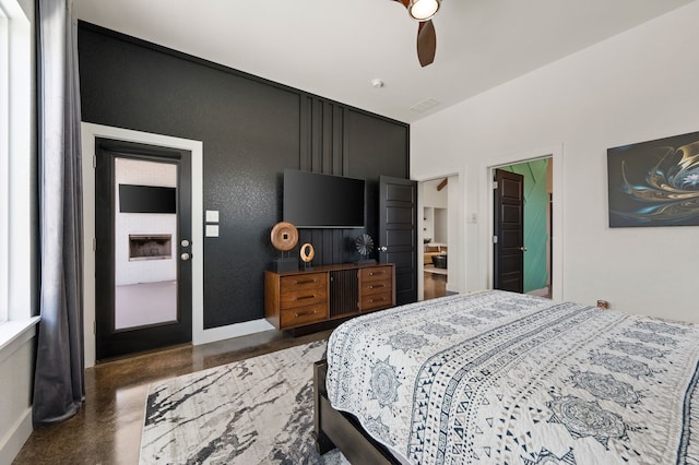 bedroom with baseboards, concrete flooring, and ceiling fan