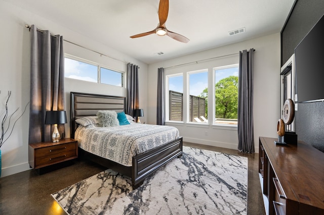 bedroom with baseboards, a ceiling fan, and visible vents