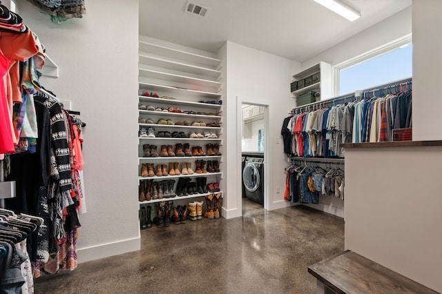 spacious closet featuring washer / clothes dryer and visible vents