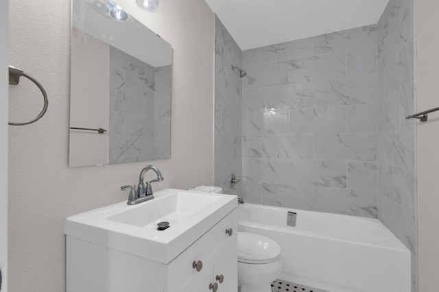 bathroom featuring toilet, shower / bathing tub combination, and vanity