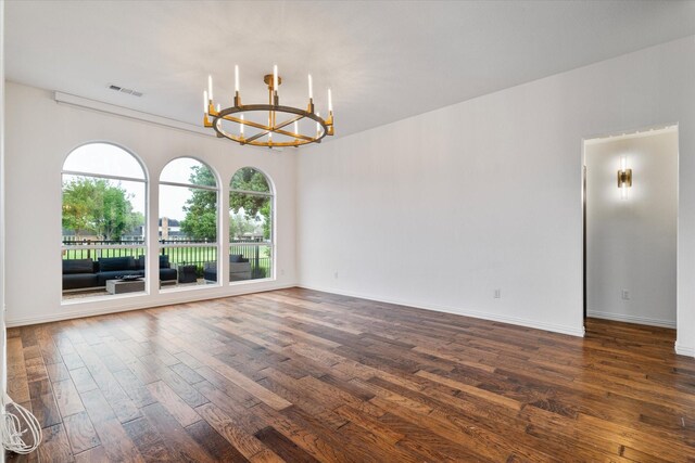 1619 Villa Ct, Corinth, TX 76210 - unfurnished room with a chandelier, dark wood-style flooring, and baseboards