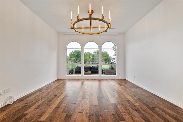 1619 Villa Ct, Corinth, TX 76210 - spare room featuring a chandelier, dark wood-type flooring, and baseboards