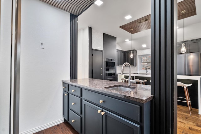 1619 Villa Ct, Corinth, TX 76210 - bathroom featuring wood finished floors, baseboards, vanity, and recessed lighting