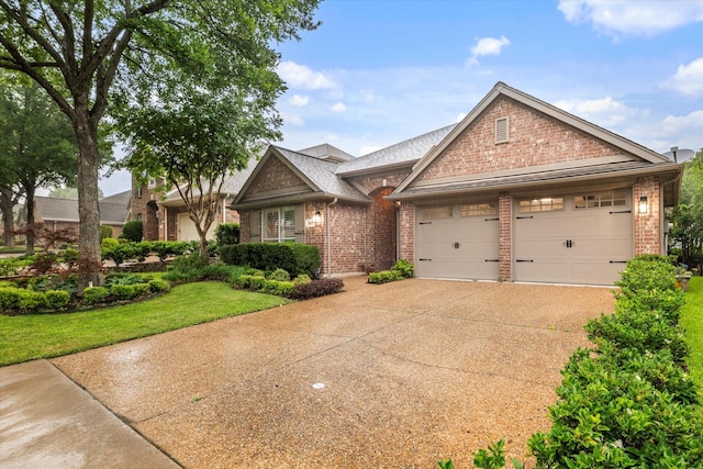 1619 Villa Ct, Corinth, TX 76210 - view of front of home with brick siding, an attached garage, driveway, and a front lawn