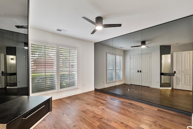 1619 Villa Ct, Corinth, TX 76210 - unfurnished bedroom featuring wood finished floors, baseboards, and ceiling fan