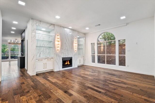 1619 Villa Ct, Corinth, TX 76210 - unfurnished living room featuring dark wood-style floors, a premium fireplace, plenty of natural light, baseboards, and recessed lighting