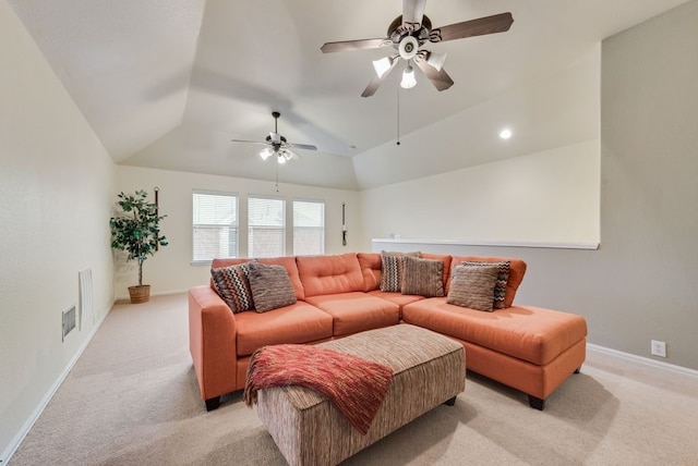 living room with a ceiling fan, visible vents, light colored carpet, baseboards, and lofted ceiling