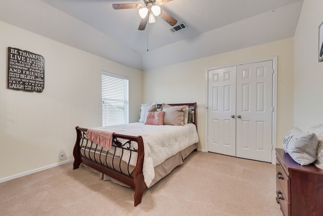 bedroom featuring visible vents, lofted ceiling, baseboards, ceiling fan, and light colored carpet
