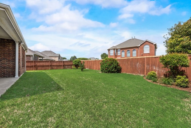 view of yard featuring a fenced backyard