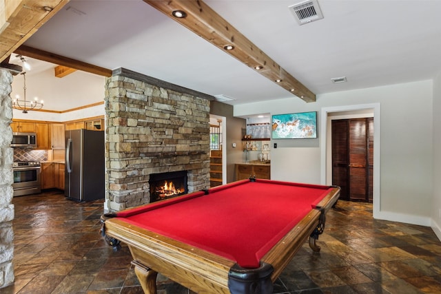 rec room featuring visible vents, stone tile floors, beam ceiling, and a fireplace