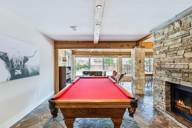 game room with visible vents, stone tile flooring, baseboards, a stone fireplace, and pool table