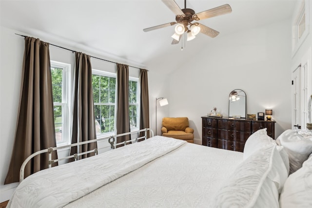 bedroom with ceiling fan and vaulted ceiling