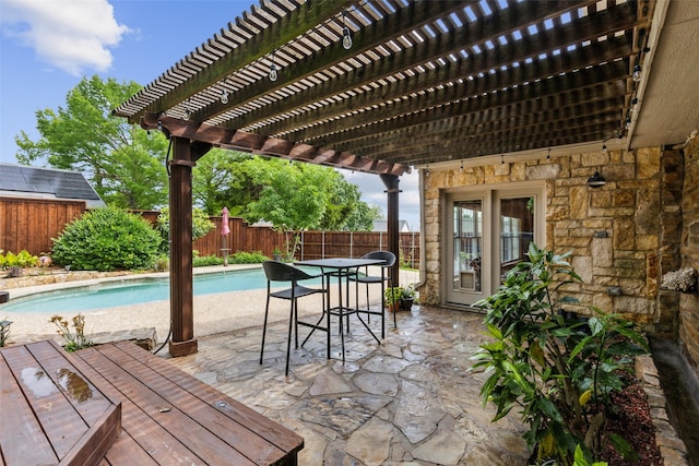 view of swimming pool featuring a patio, a pergola, a fenced in pool, and a fenced backyard