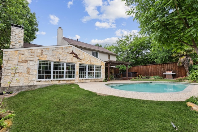 view of pool featuring fence, a pergola, a fenced in pool, a patio area, and a lawn