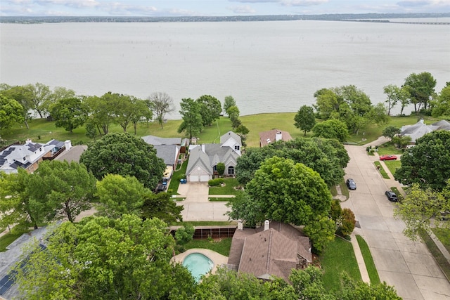 bird's eye view featuring a water view and a residential view