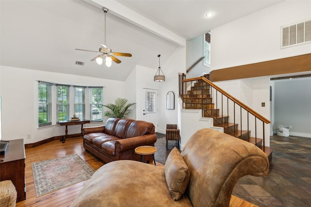 living area with stairway, baseboards, a ceiling fan, and visible vents