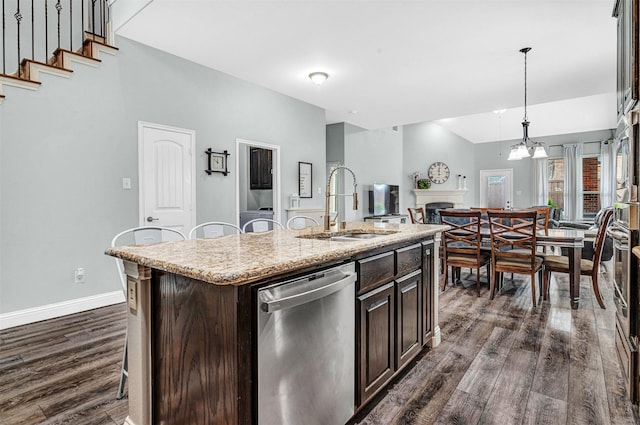 kitchen with a sink, stainless steel dishwasher, dark wood-style floors, and dark brown cabinets
