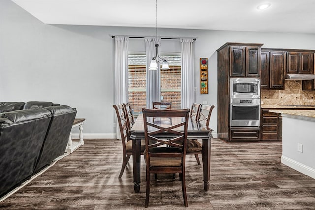 dining area featuring dark wood-type flooring, recessed lighting, and baseboards
