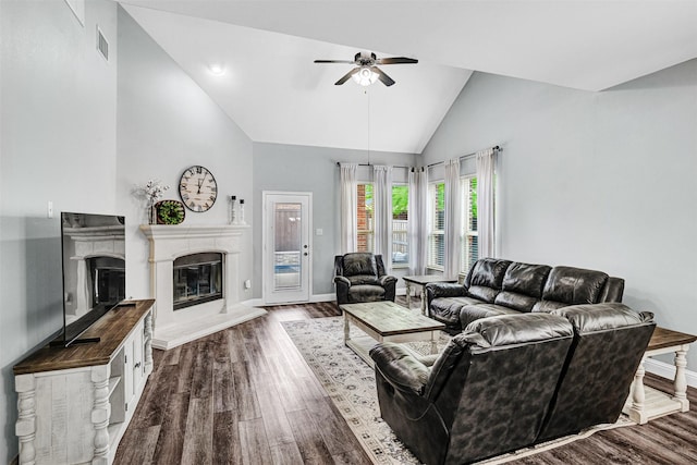 living area featuring ceiling fan, visible vents, baseboards, and high vaulted ceiling