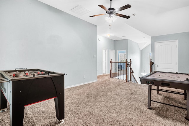 game room with ceiling fan, visible vents, vaulted ceiling, baseboards, and carpet flooring