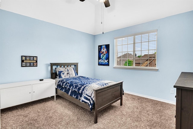 carpeted bedroom featuring a ceiling fan, baseboards, and vaulted ceiling
