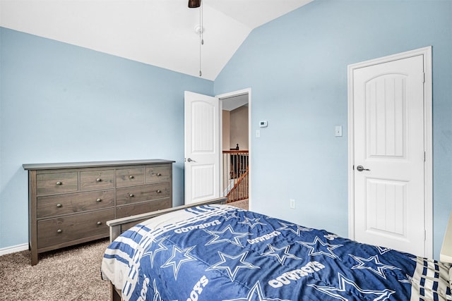carpeted bedroom featuring ceiling fan and vaulted ceiling