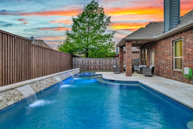 pool at dusk with a patio area, a hot tub, a fenced in pool, a fenced backyard, and an outdoor hangout area
